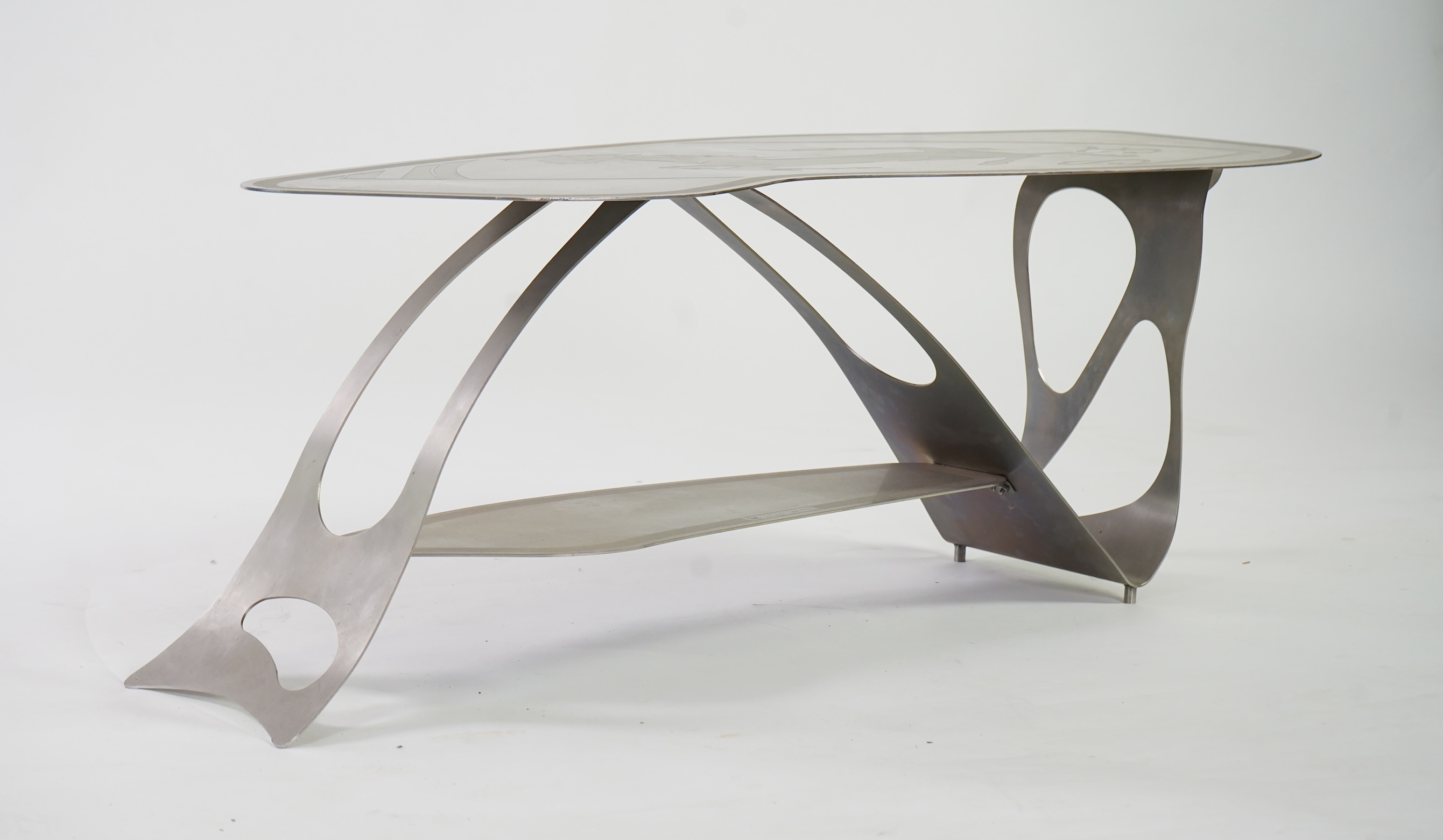 Pietro Psaier (Italian 1939-2004) A Ferrari polished steel coffee table, 1 of 3, in homage to Carlo Mollino